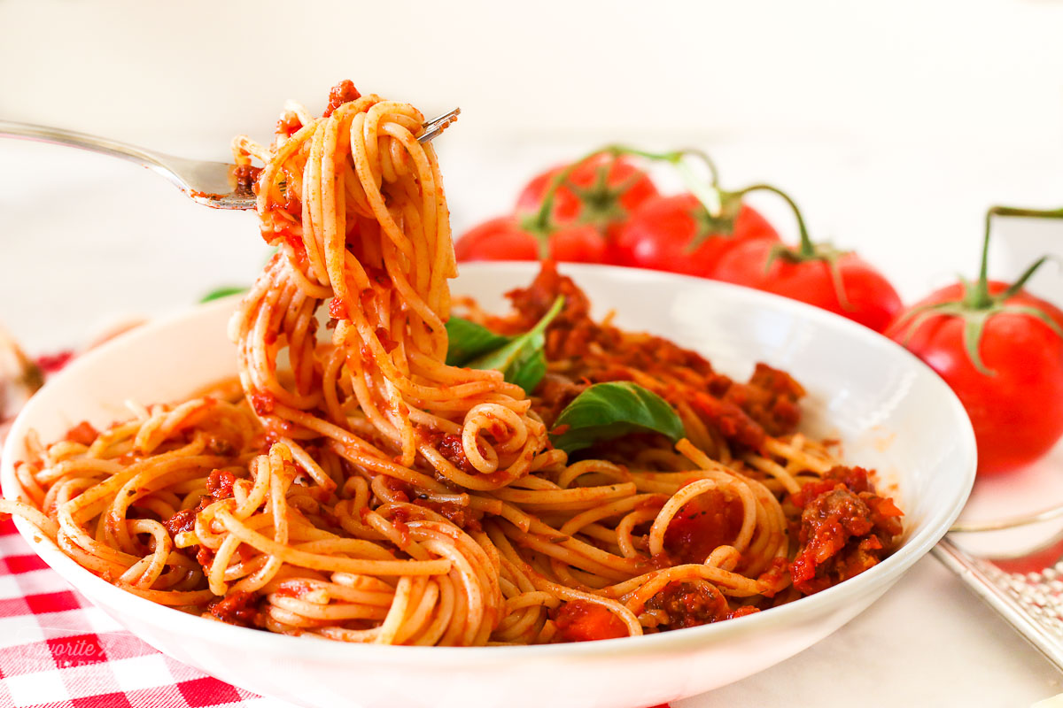 Spaghetti being twirled with a fork