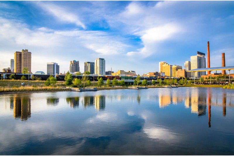 Stunning reflections of buildings in Birmingham, Alabama on still waters