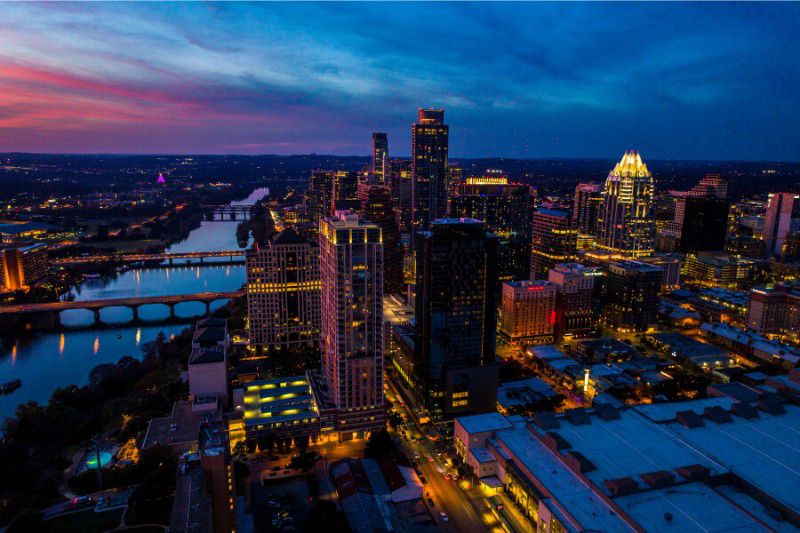 Twilight view of city buildings in Austin, Texas with vibrant sky
