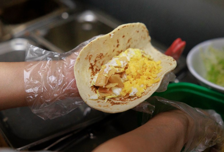 A migas taco is prepared at the Little Taco Factory on McCullough Avenue.