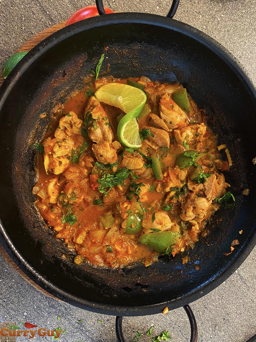 Adding onions to the Balti bowl